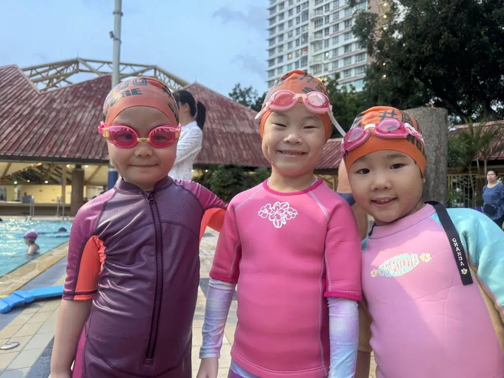 3 friends learning to swim together at the clementi swimming complex with AQZOG.
